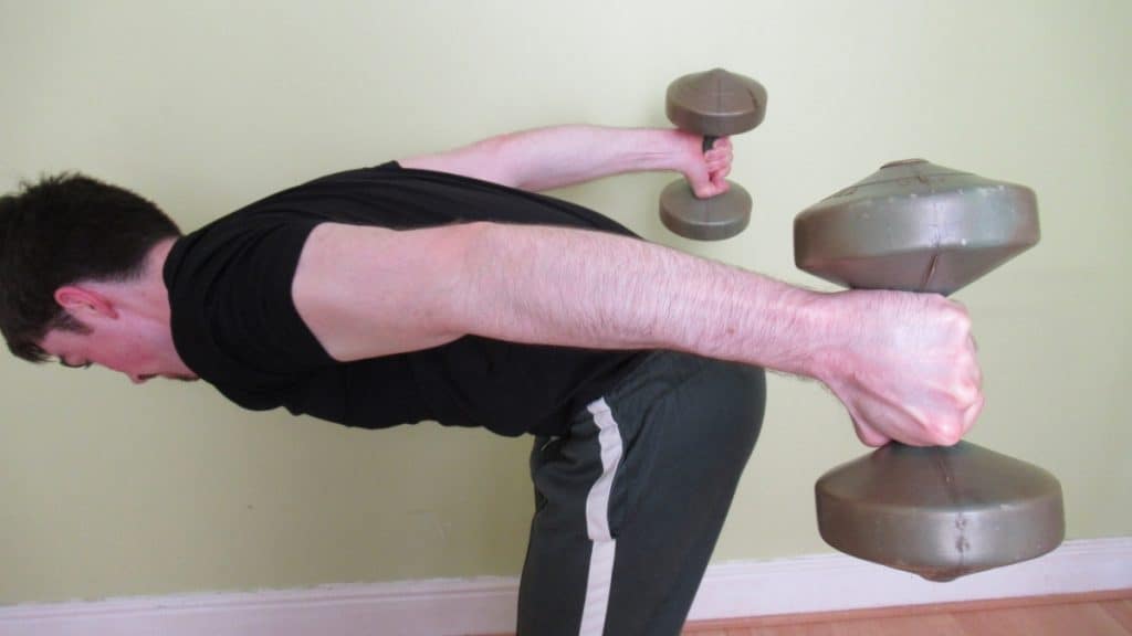 A man doing a bent over arm extension