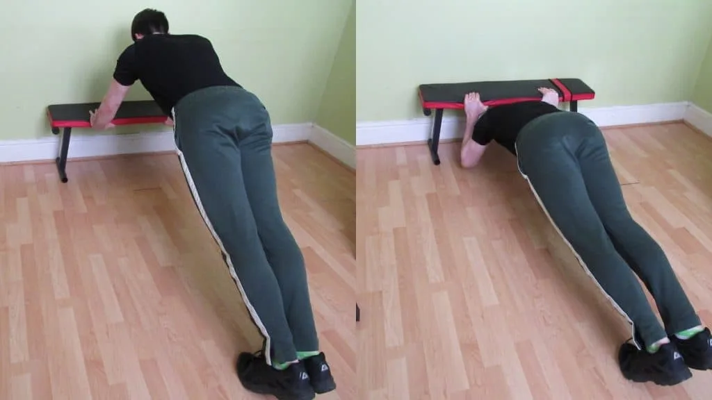 A man doing bodyweight tricep extensions using a bench