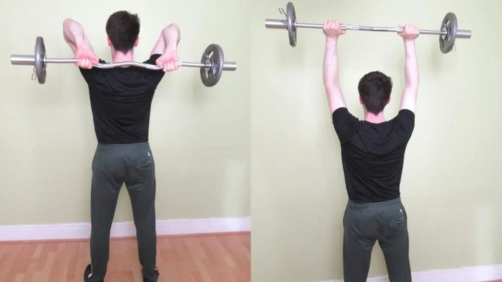 A man performing a cambered bar French press