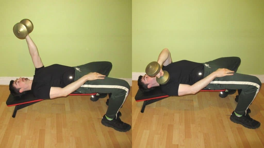 A man doing a decline cross body dumbbell tricep extension