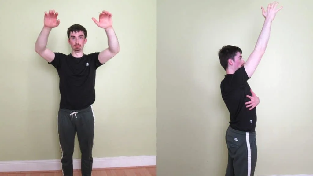 A man warming up his shoulders before a workout