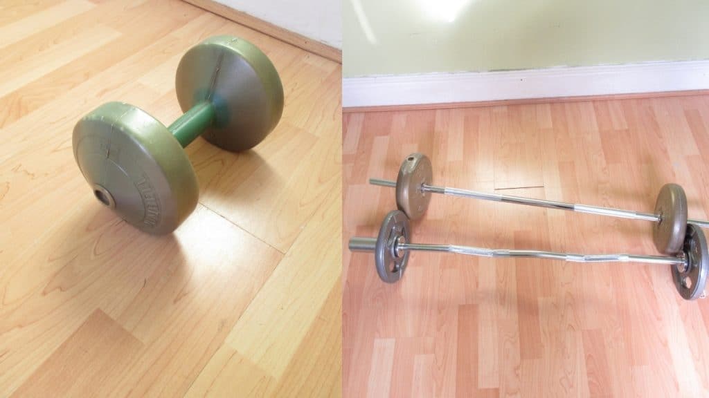 A dumbbell and two barbells on the floor