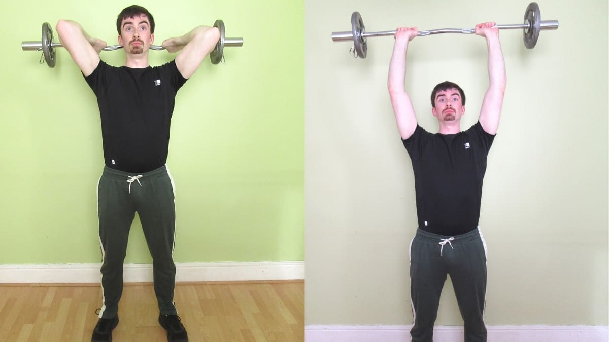 A man doing a standing EZ bar French press for his triceps