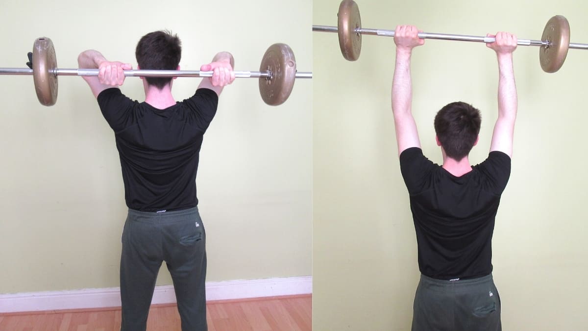 A man doing a barbell French curl exercise for his triceps