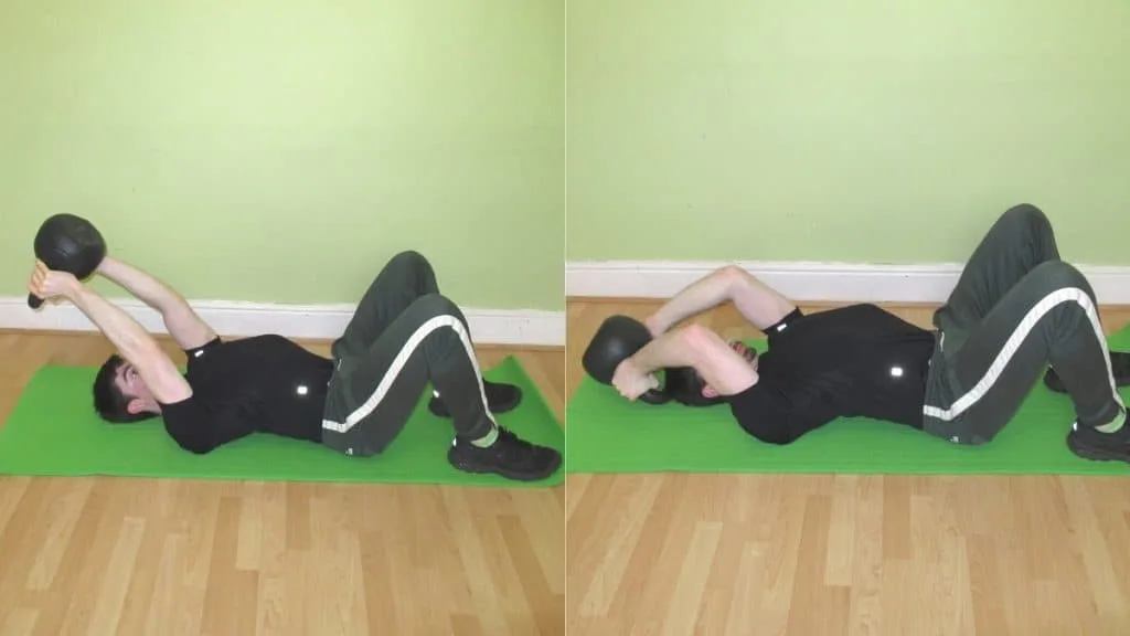 A man doing a French press with kettlebells