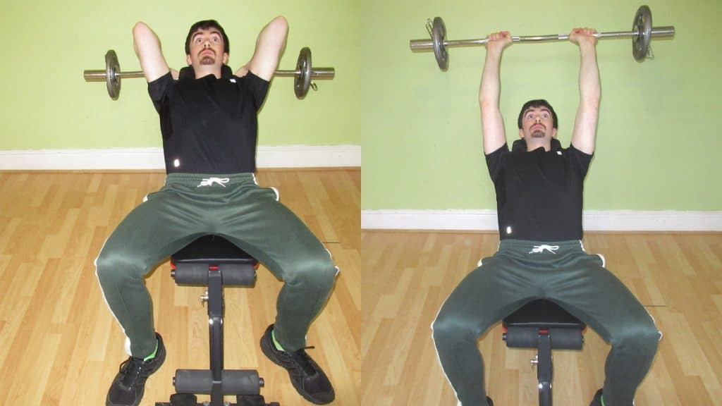 A man doing some incline French presses with an EZ bar