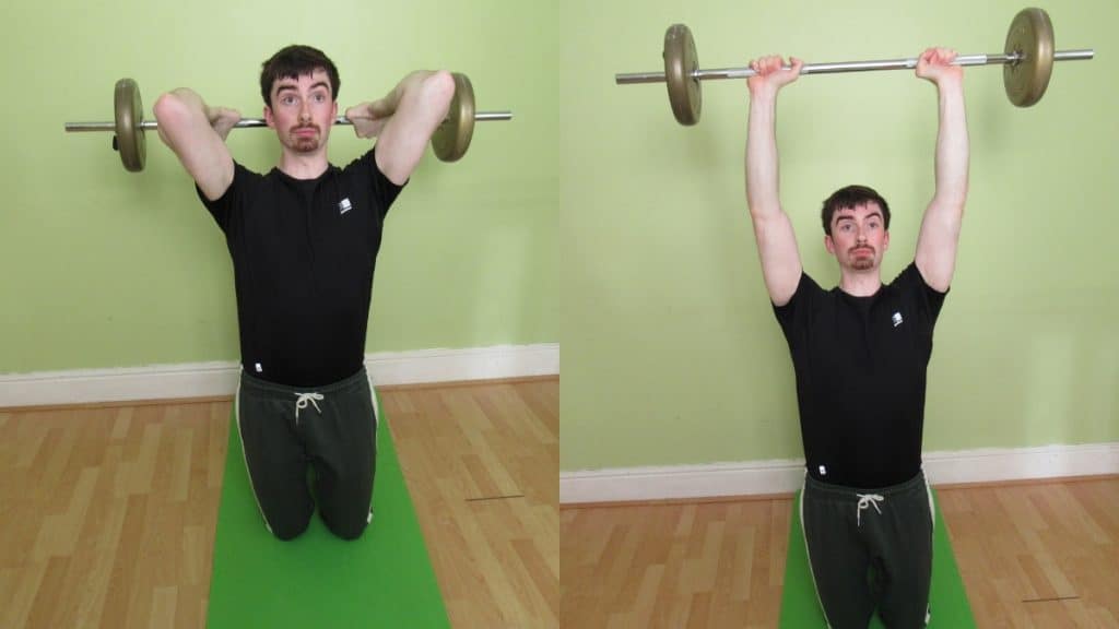 A man doing a kneeling barbell overhead extension for his triceps