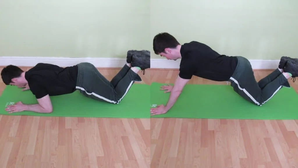 A man doing a kneeling bodyweight tricep extension