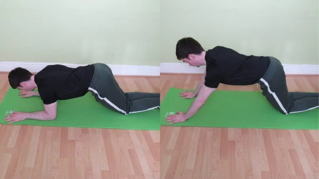 A man doing a kneeling plank to triceps extension