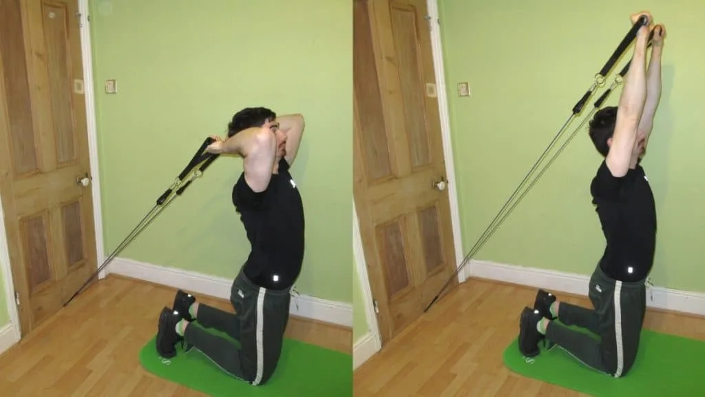 A man doing a kneeling resistance band tricep extension