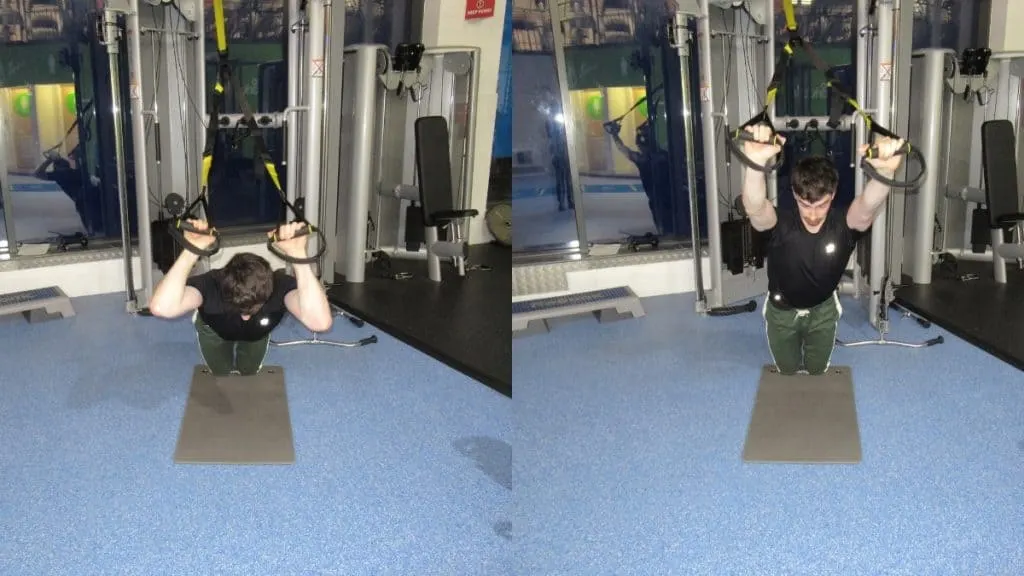 A man doing a kneeling TRX tricep extension at the gym