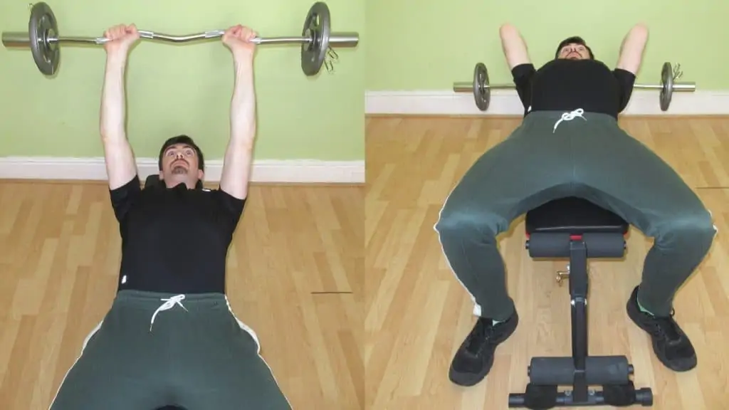 A man doing a lying tricep extension with an EZ bar