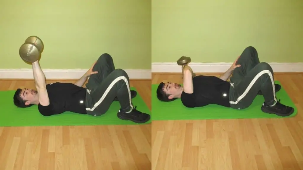 A man performing a one arm cross body tricep extension on the floor