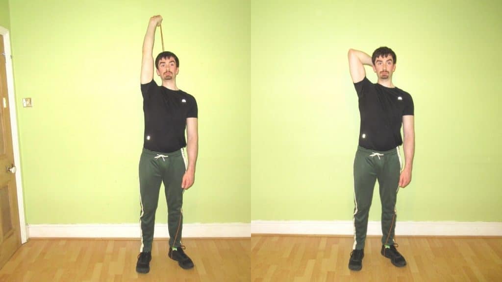 A man doing a one arm resistance band French press with a single band