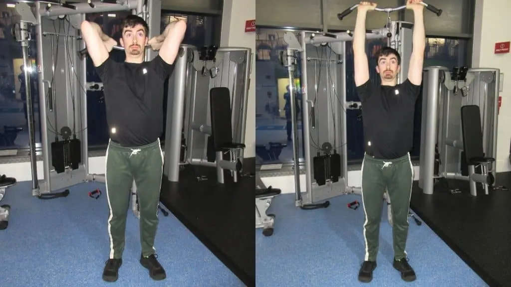 A man performing an overhead tricep extension with cables at the gym