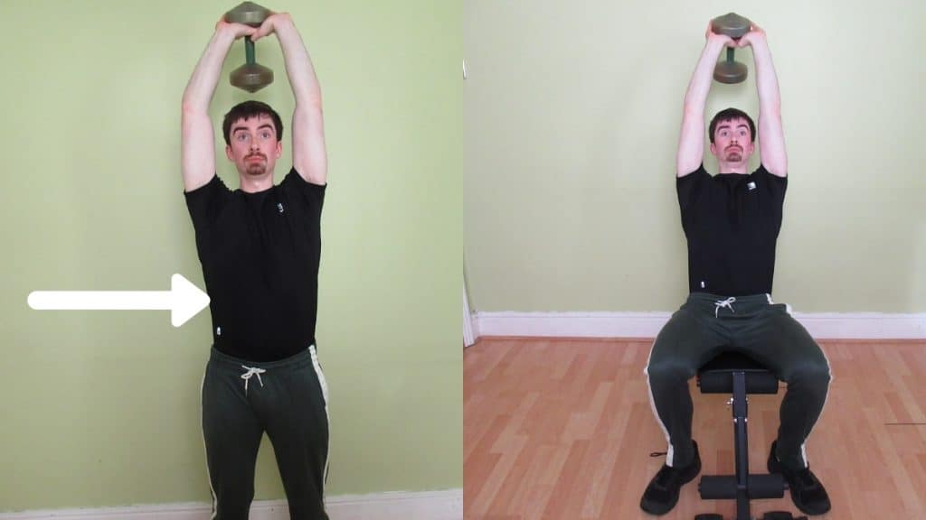 A man doing overhead tricep extensions with a dumbbell