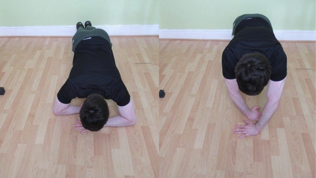 A man performing a plank with triceps extension with his arms crossed