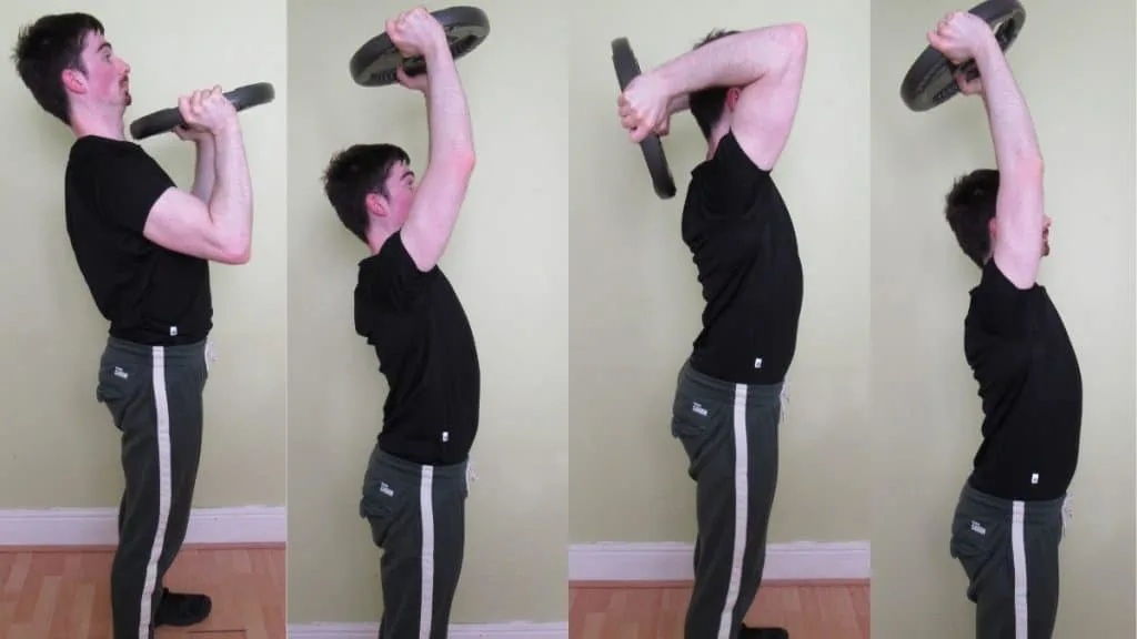 A man doing a plate press to tricep extension