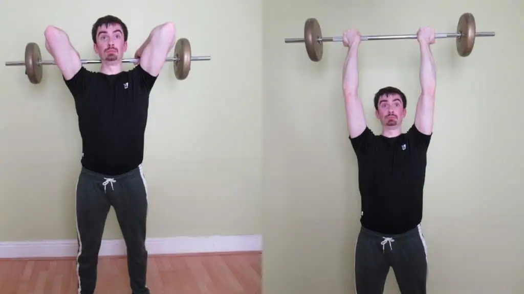 A man doing a reverse grip barbell tricep extension