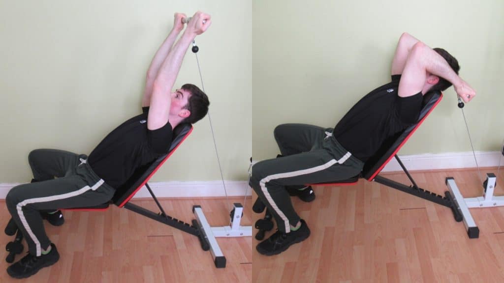 A man performing a reverse grip cable incline tricep extension