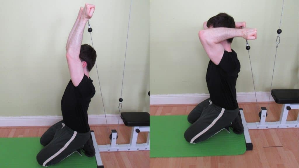 A man doing a reverse grip kneeling cable triceps extension