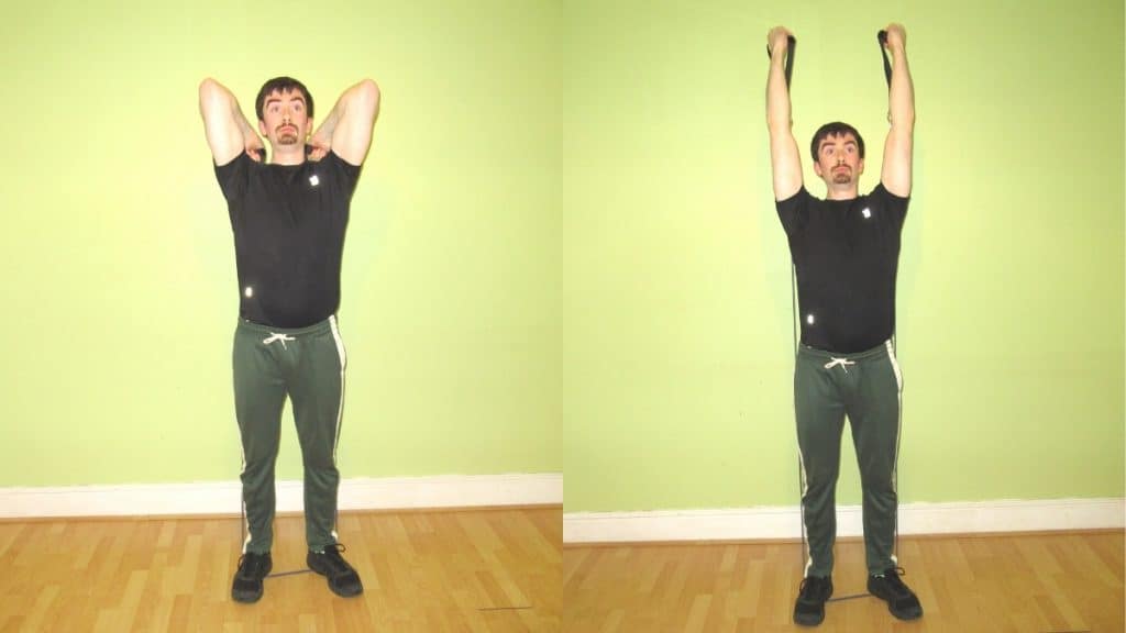 A man performing a reverse grip resistance band tricep extension