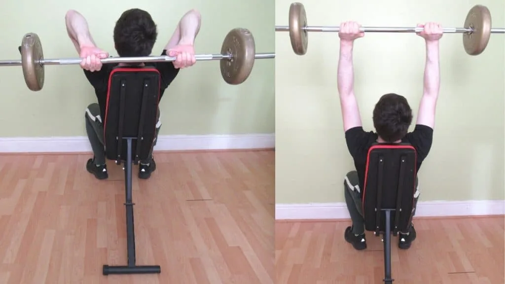 A man performing a seated BB French press