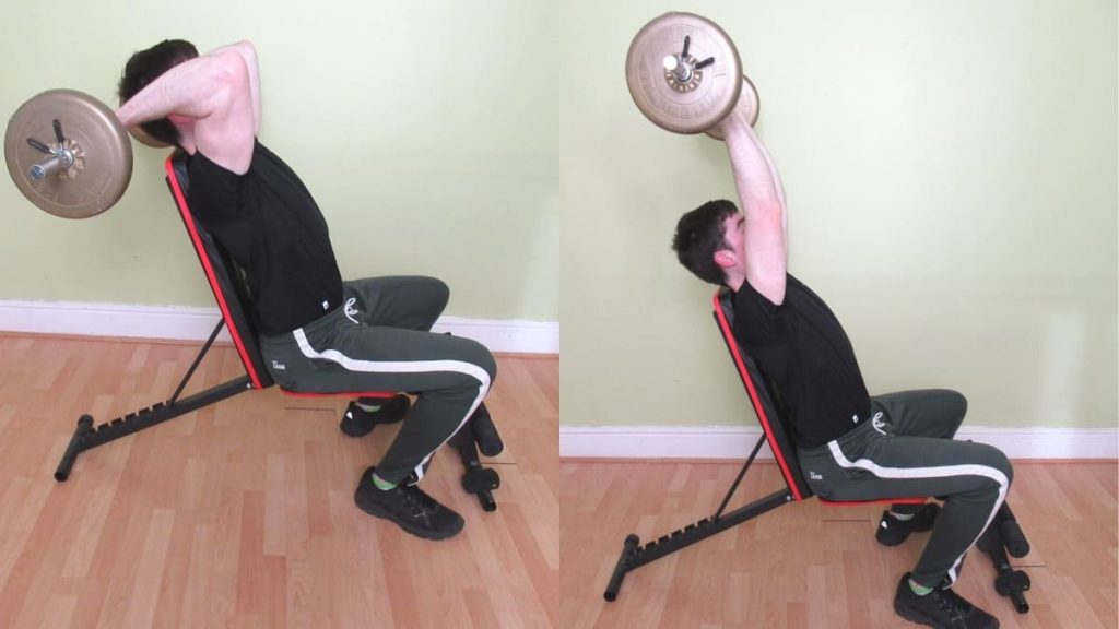 A man performing a seated French press for his triceps