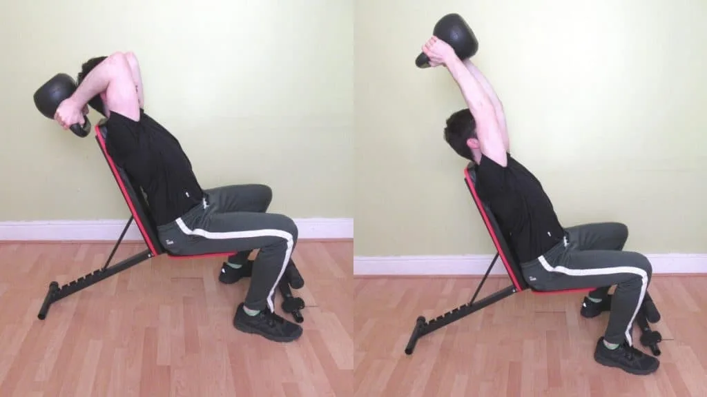 A man doing a seated KB French press