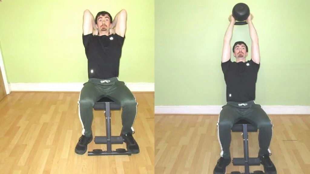 A man doing a seated kettlebell tricep extension during his workout