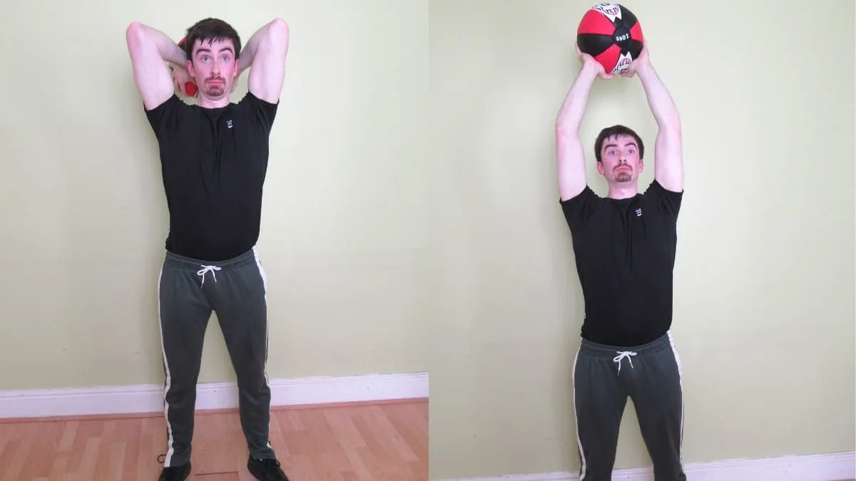 A man doing a standing medicine ball French press for his triceps