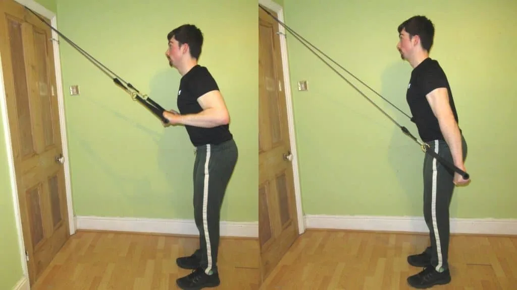 A man doing a standing resistance band tricep extension