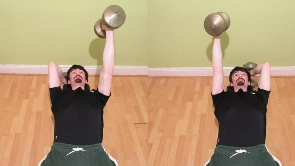 A man performing dumbbell alternating skull crushers