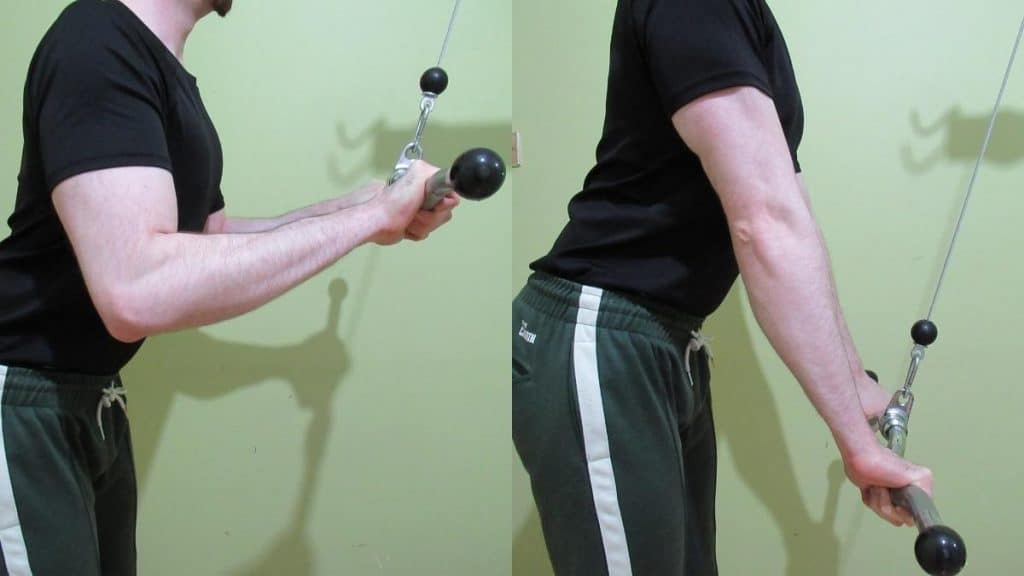 A man performing a cable EZ bar pushdown for his triceps