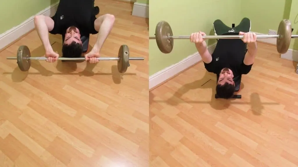 A man doing decline barbell extensions