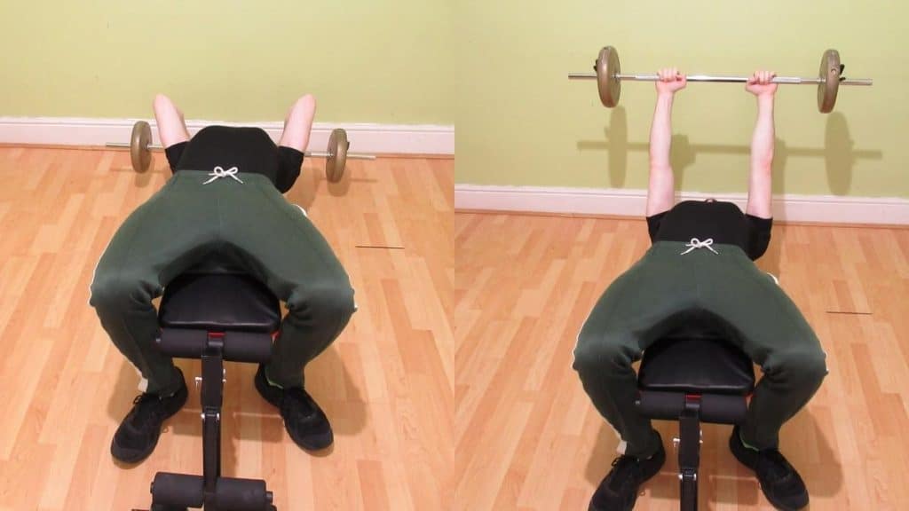 A man performing a decline barbell tricep extension