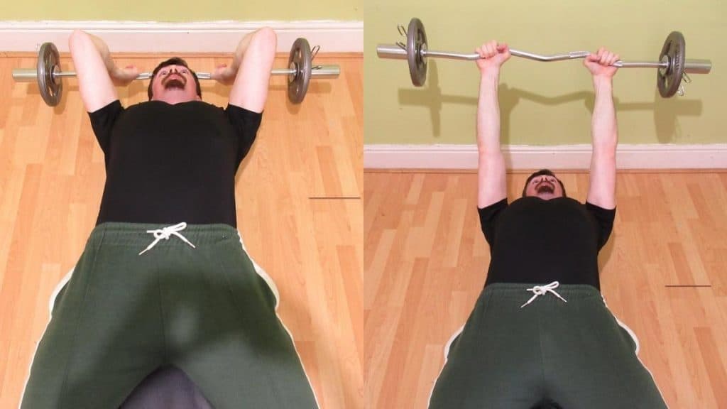 A man performing decline EZ bar tricep extensions