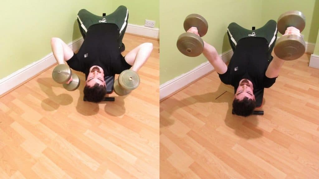 A man doing a dumbbell decline lying triceps extension