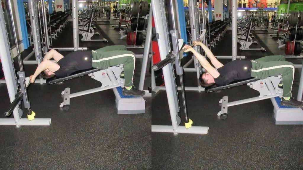 A man doing decline Smith machine skull crushers