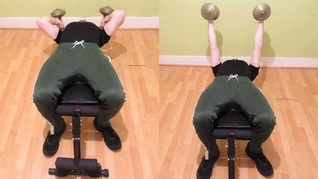 A man performing a dumbbell decline tricep extension