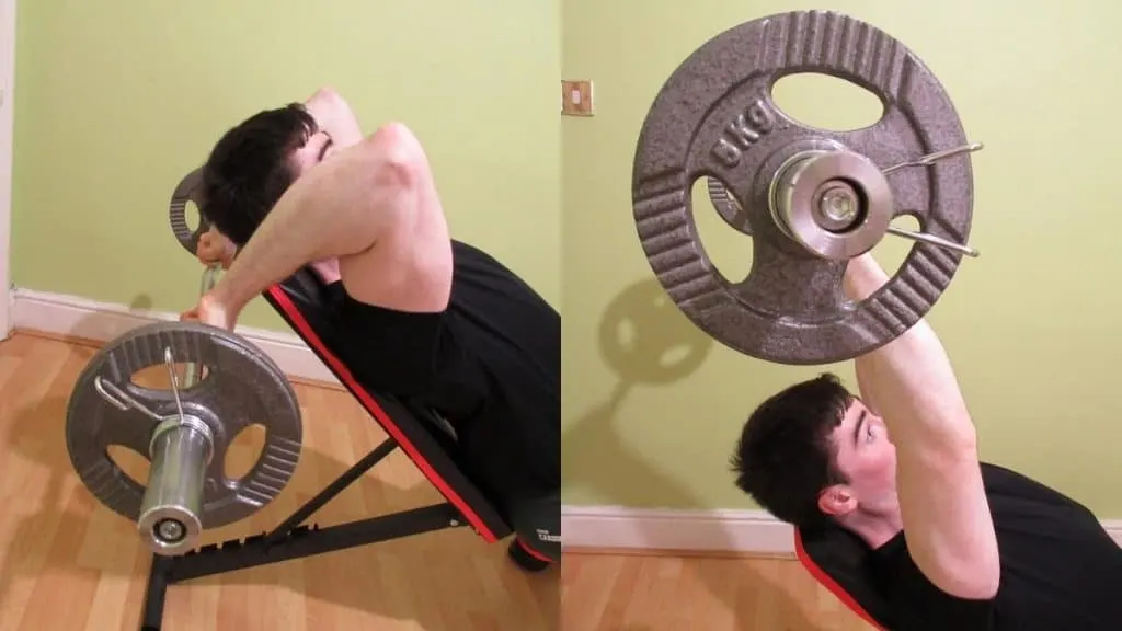 A man doing an EZ bar incline tricep extension