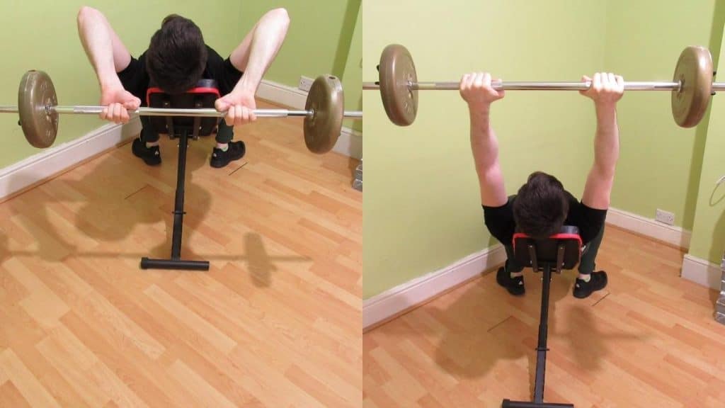 A man performing an incline barbell tricep extension