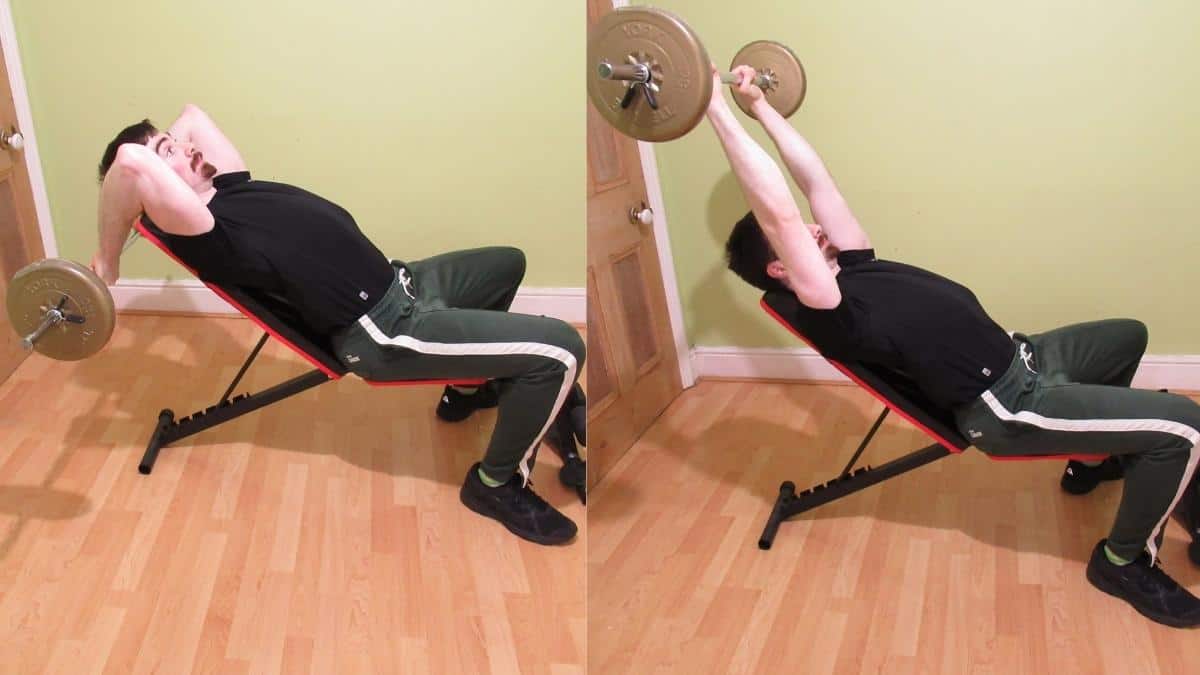 A man performing an incline barbell triceps extension