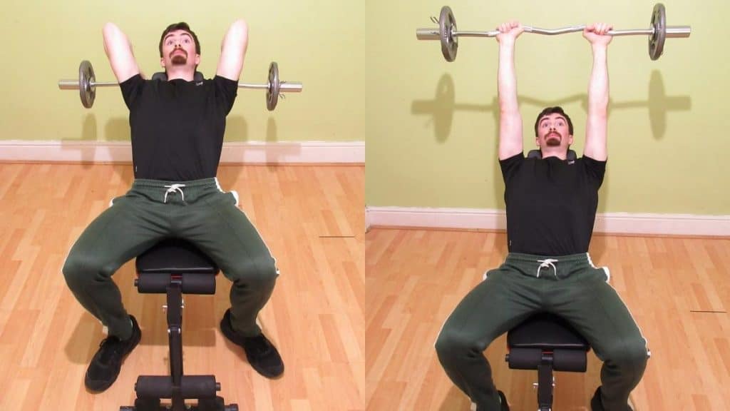 A man doing incline bench skull crushers with an EZ bar