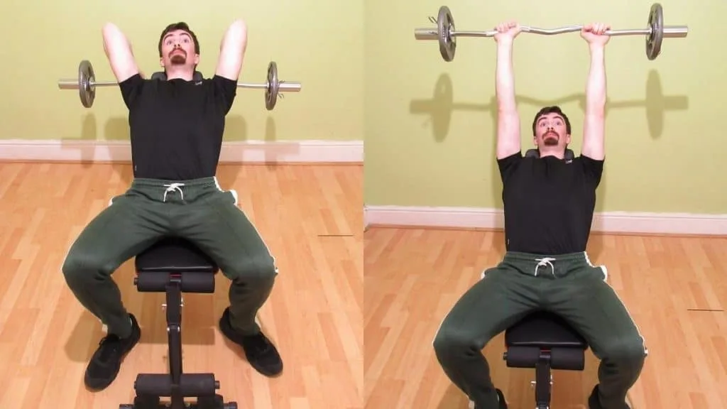 A man doing incline bench skull crushers with an EZ bar