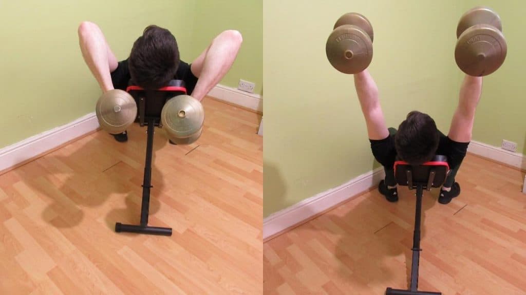 A man doing an incline dumbbell extension for his triceps
