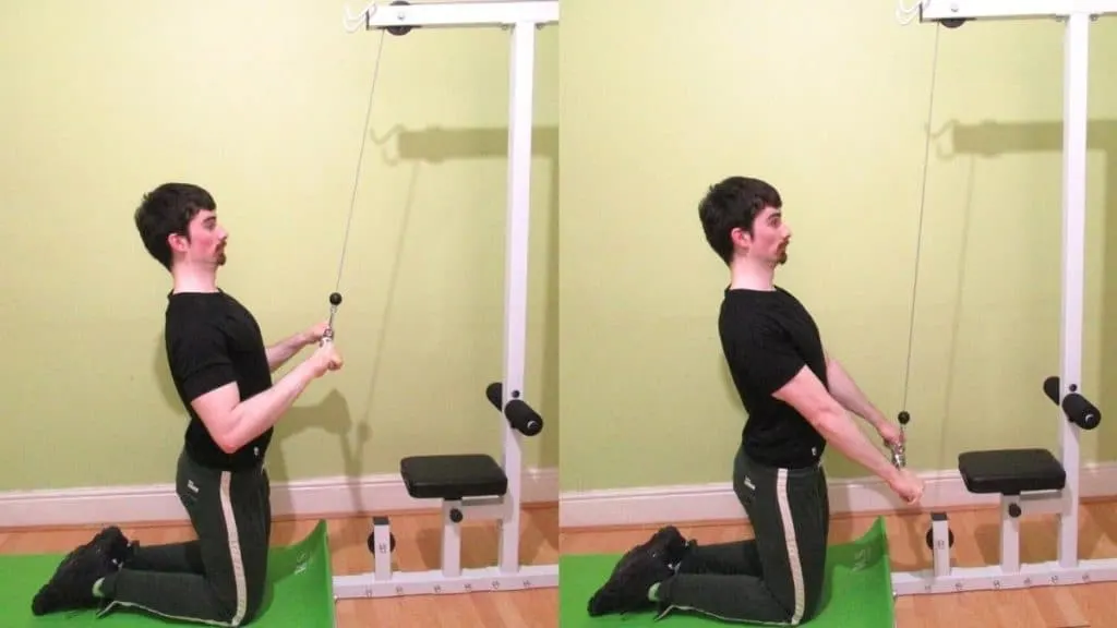 A man doing a kneeling straight bar tricep pushdown