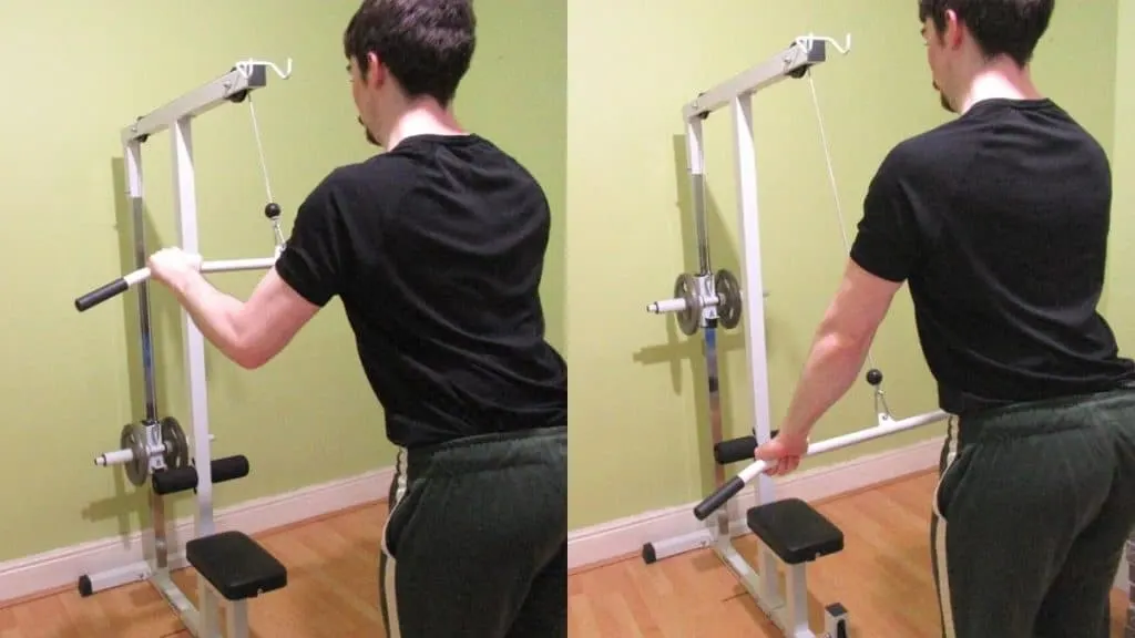 A man doing lat bar wide grip tricep pushdowns