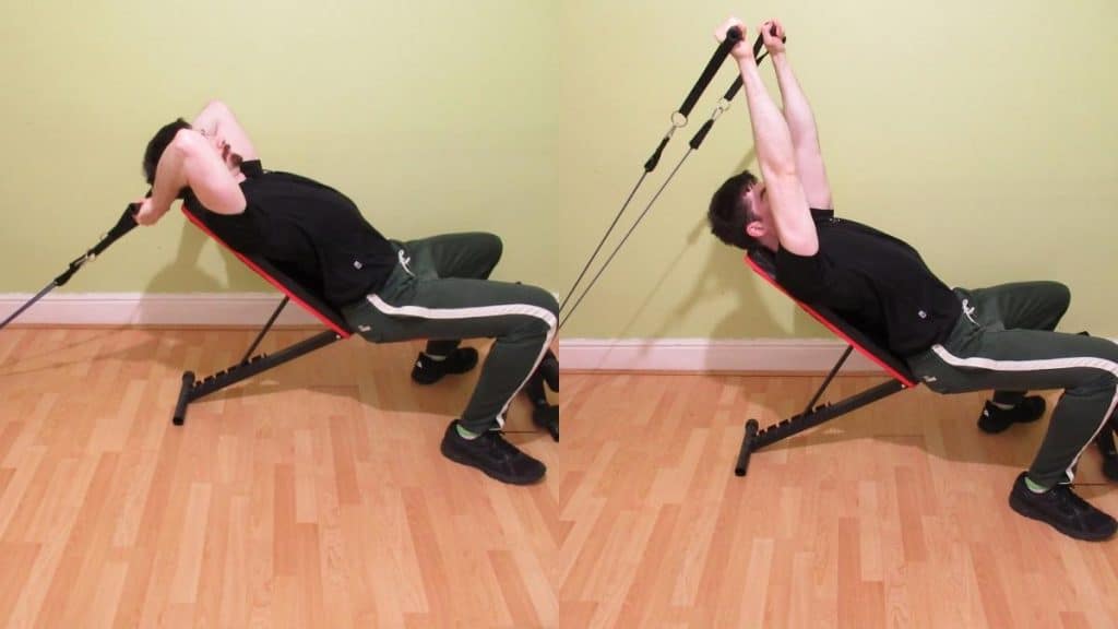 A man doing a resistance band incline bench skull crusher