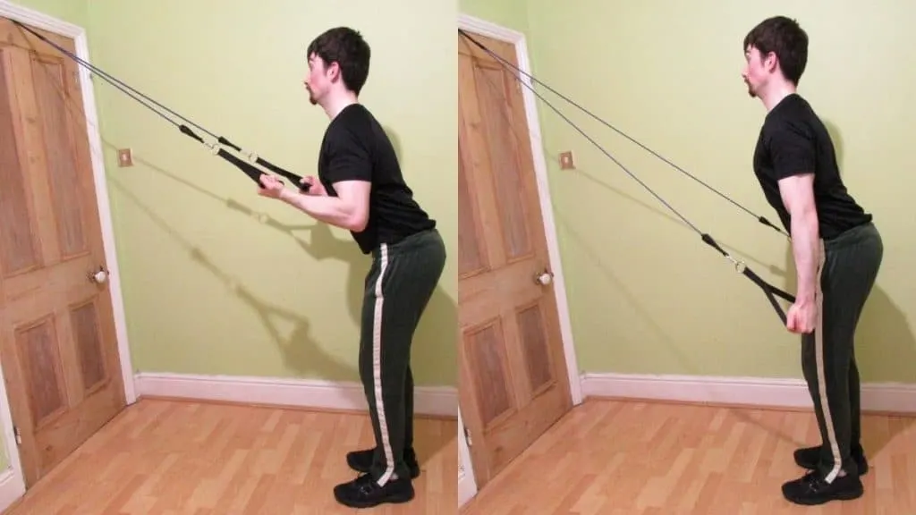 A man performing a reverse grip resistance band pushdown